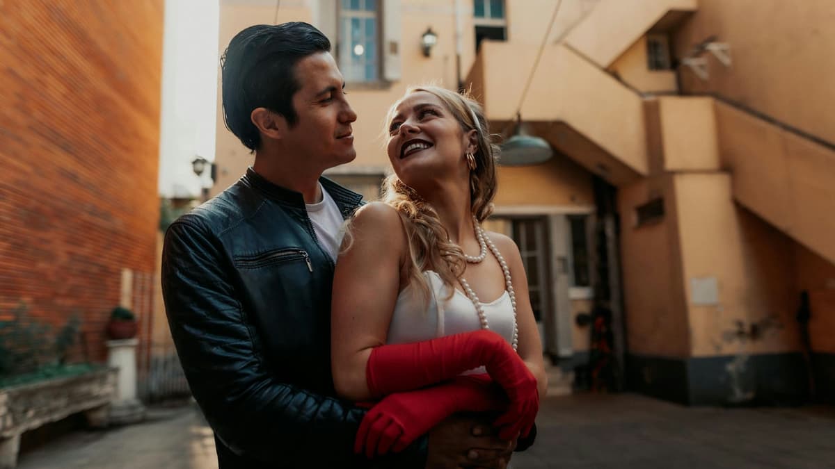 Happy couple embracing outdoors in Buenos Aires, showcasing love and affection in urban setting.