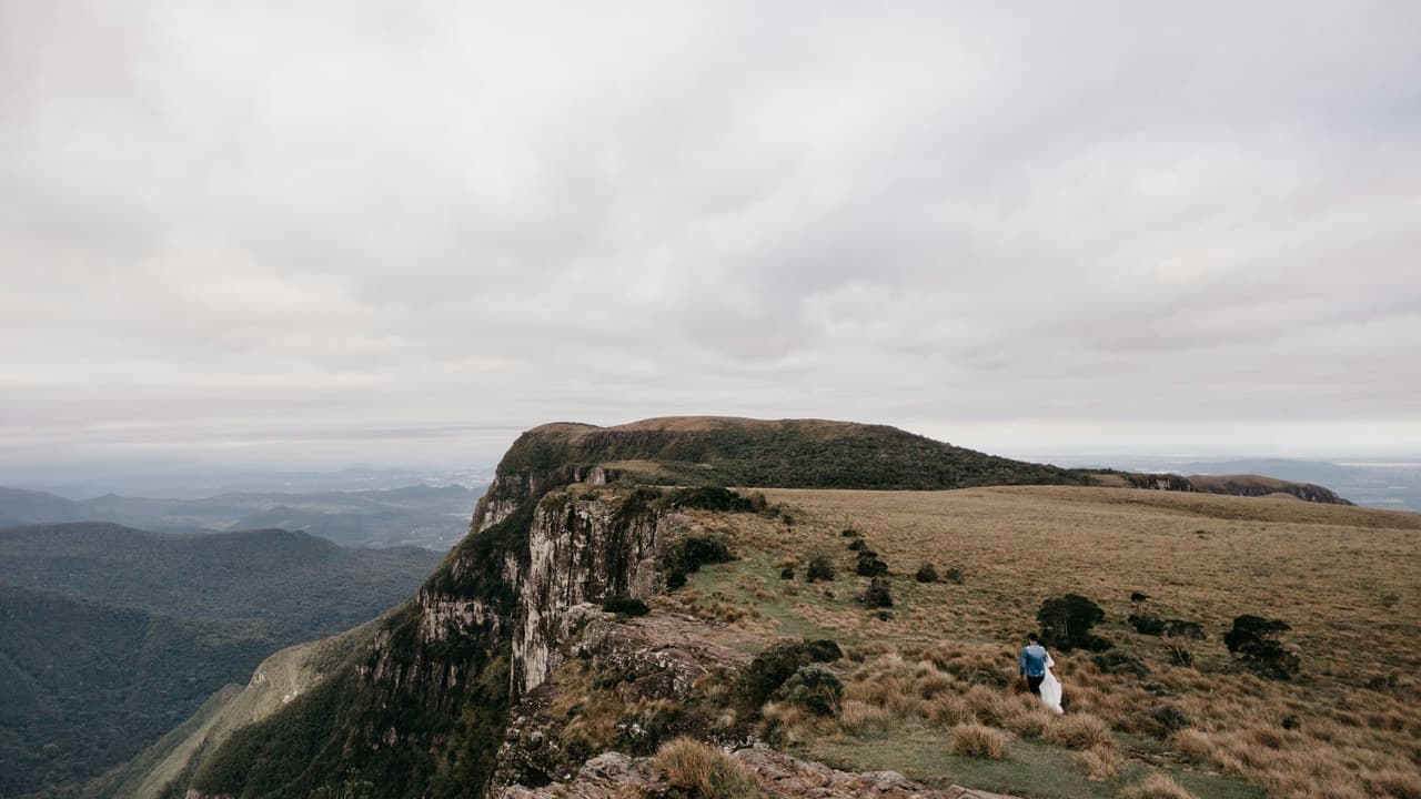 Dramatic vista of a mountain cliff with an overcast sky in Cambará do Sul, perfect for travel imagery.