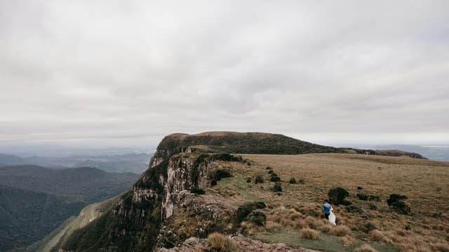 Dramatic vista of a mountain cliff with an overcast sky in Cambará do Sul, perfect for travel imagery.